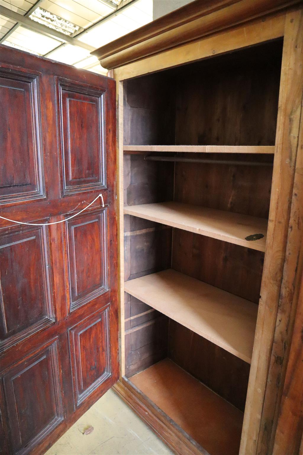 A 19th century French walnut two door panelled armoire, width 224cm, depth 58cm, height 222cm